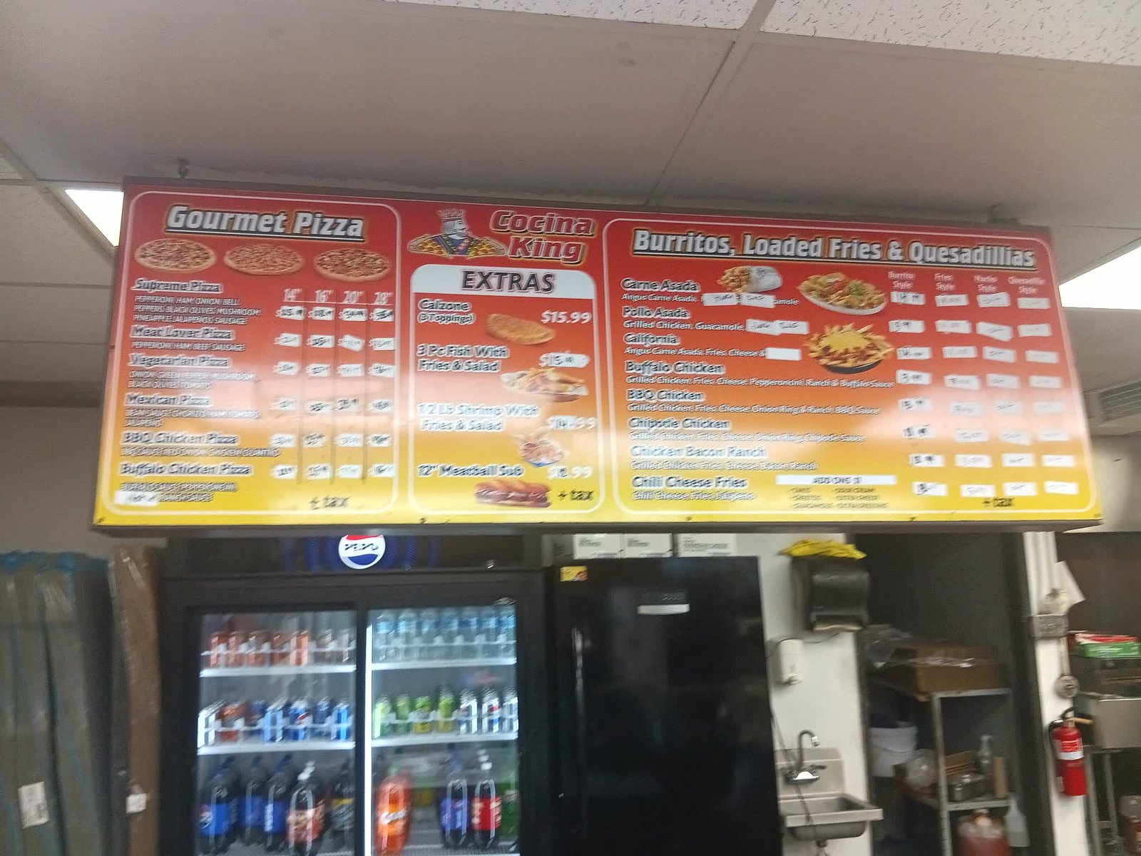 Cocina King menu board — gourmet pizza, extras, burritos and loaded fries